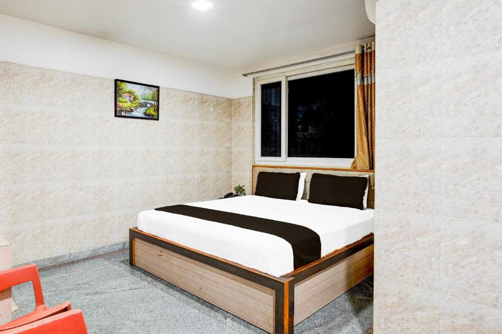 Postel nebo postele na pokoji v ubytování Super Hotel O Arcot Road Porur
