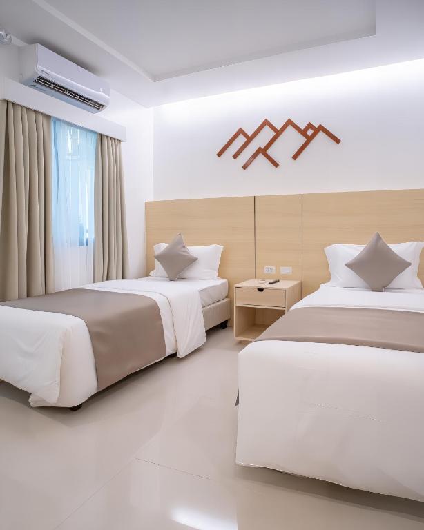 Postel nebo postele na pokoji v ubytování Panglao Vista Suites by SMS Hospitality
