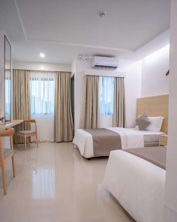 Postel nebo postele na pokoji v ubytování Panglao Vista Suites by SMS Hospitality