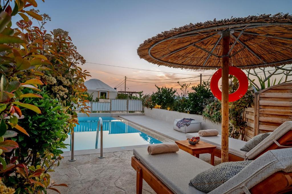 The swimming pool at or close to Ammokrinos Luxury Homes, 150m From Sea