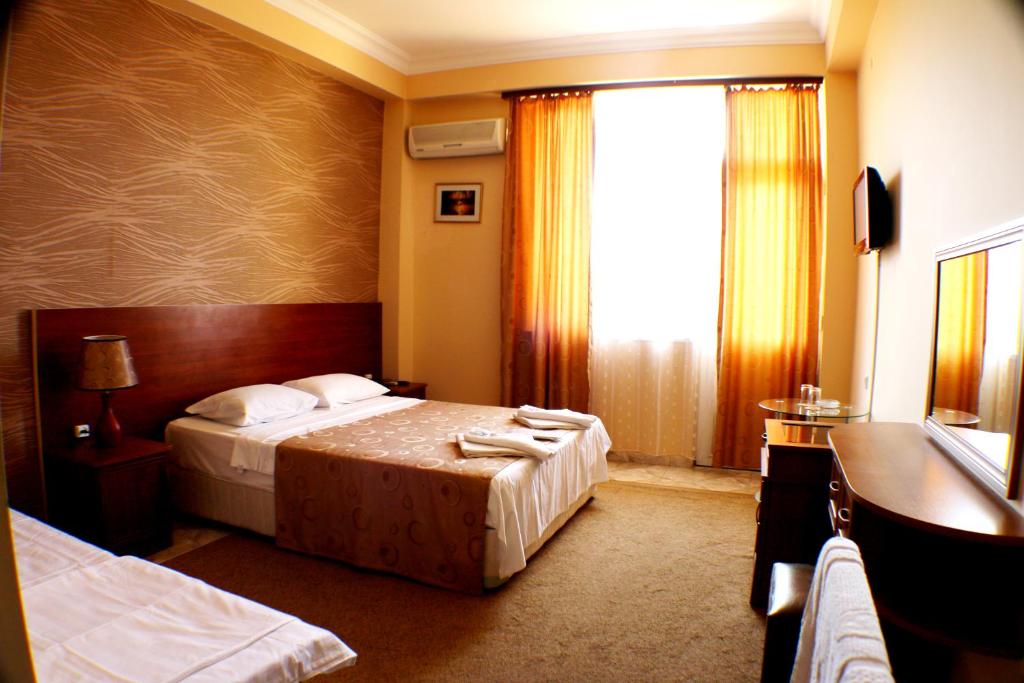 Postel nebo postele na pokoji v ubytování Hotel Condori