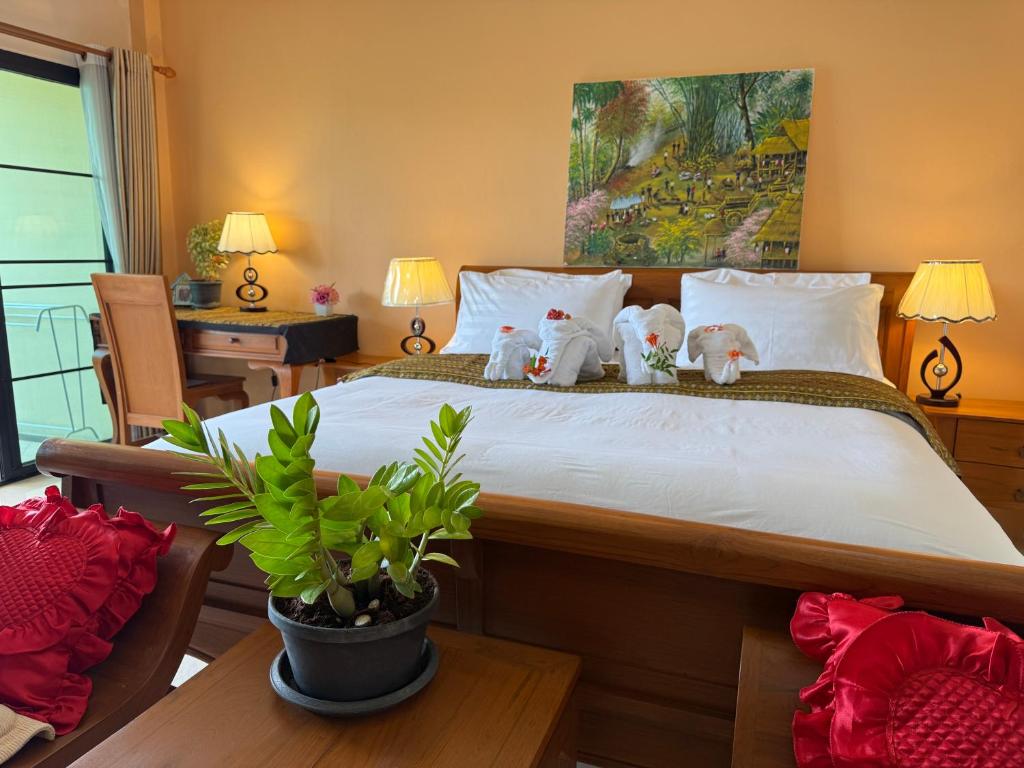 Postel nebo postele na pokoji v ubytování Laph Kham House