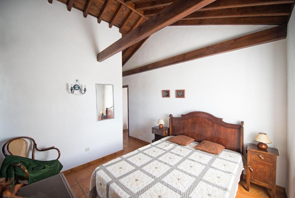 Postel nebo postele na pokoji v ubytování Casas do Capelo
