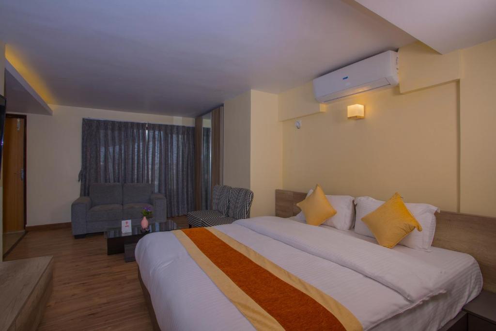 Postel nebo postele na pokoji v ubytování OYO 262 Hotel Kumari