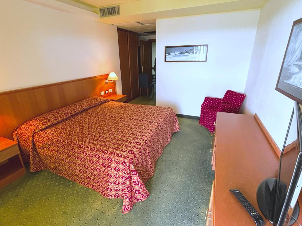 Postel nebo postele na pokoji v ubytování Hotel Rialto