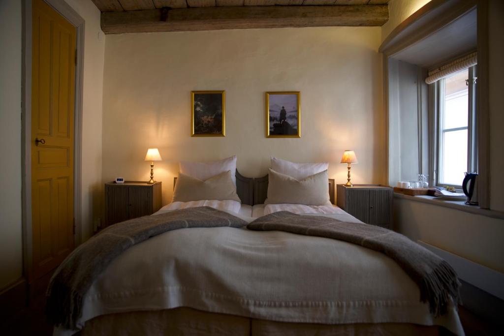 Postel nebo postele na pokoji v ubytování Hotel Sven Vintappare
