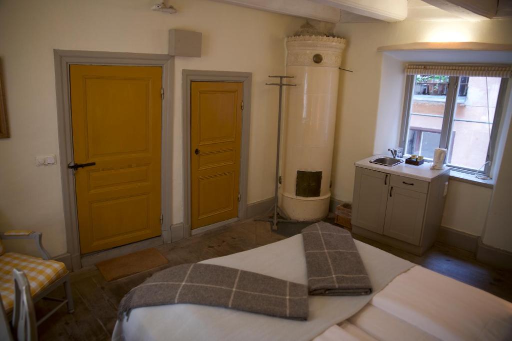 Postel nebo postele na pokoji v ubytování Hotel Sven Vintappare