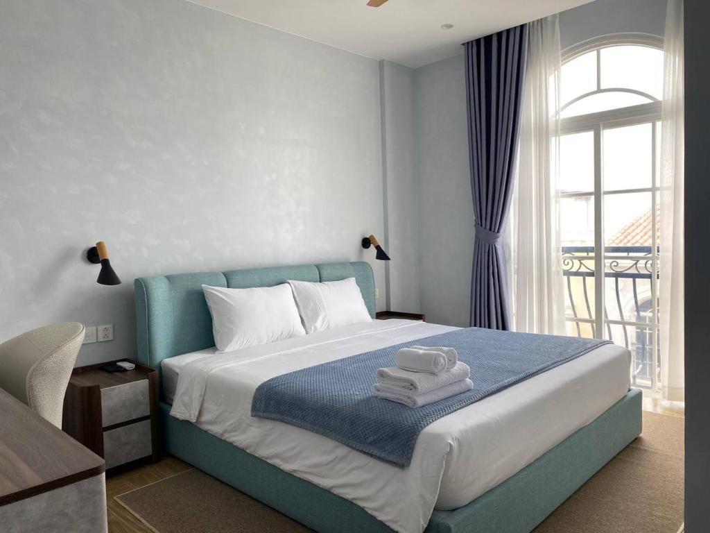 En eller flere senge i et værelse på Sandora Boutique Hotel Phu Quoc