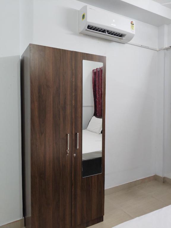 Postel nebo postele na pokoji v ubytování Capsule Home Stay