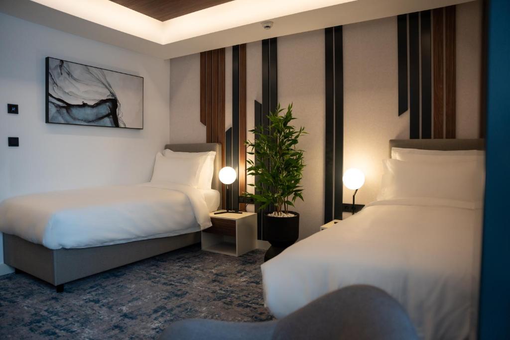 Postel nebo postele na pokoji v ubytování Hotel Rubin DHS