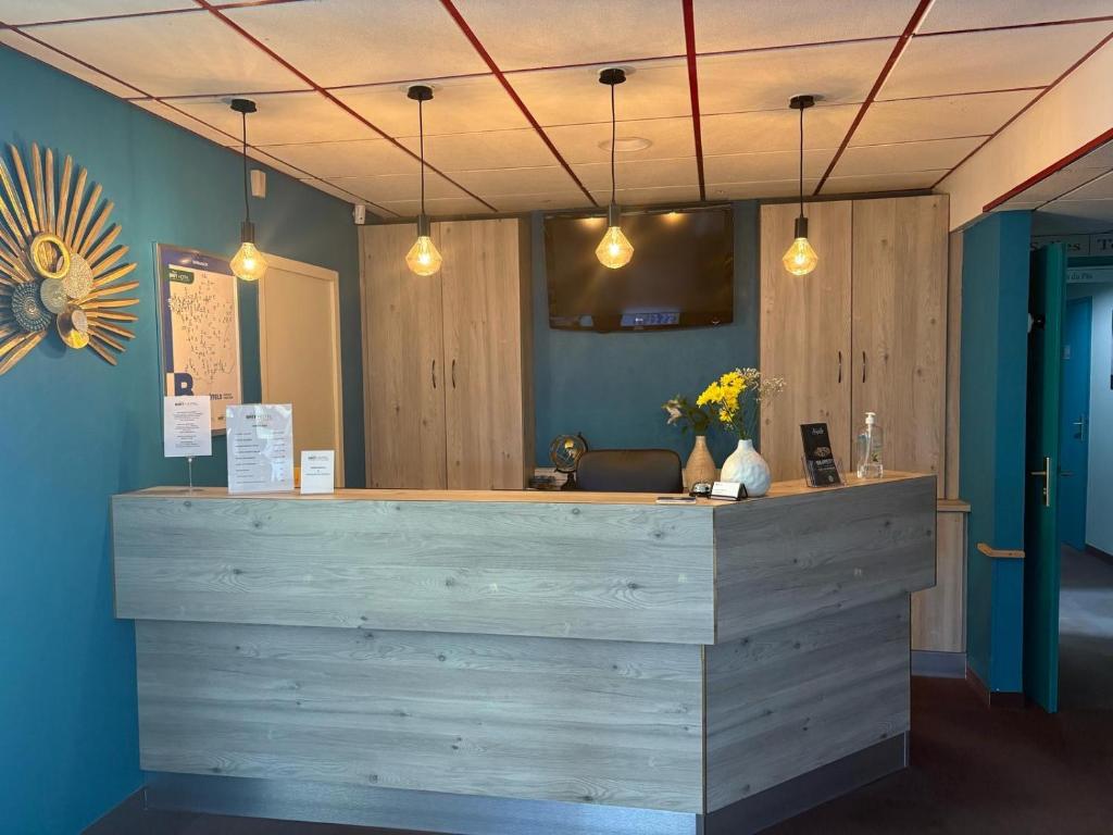 Vstupní hala nebo recepce v ubytování Brit Hotel Argentan