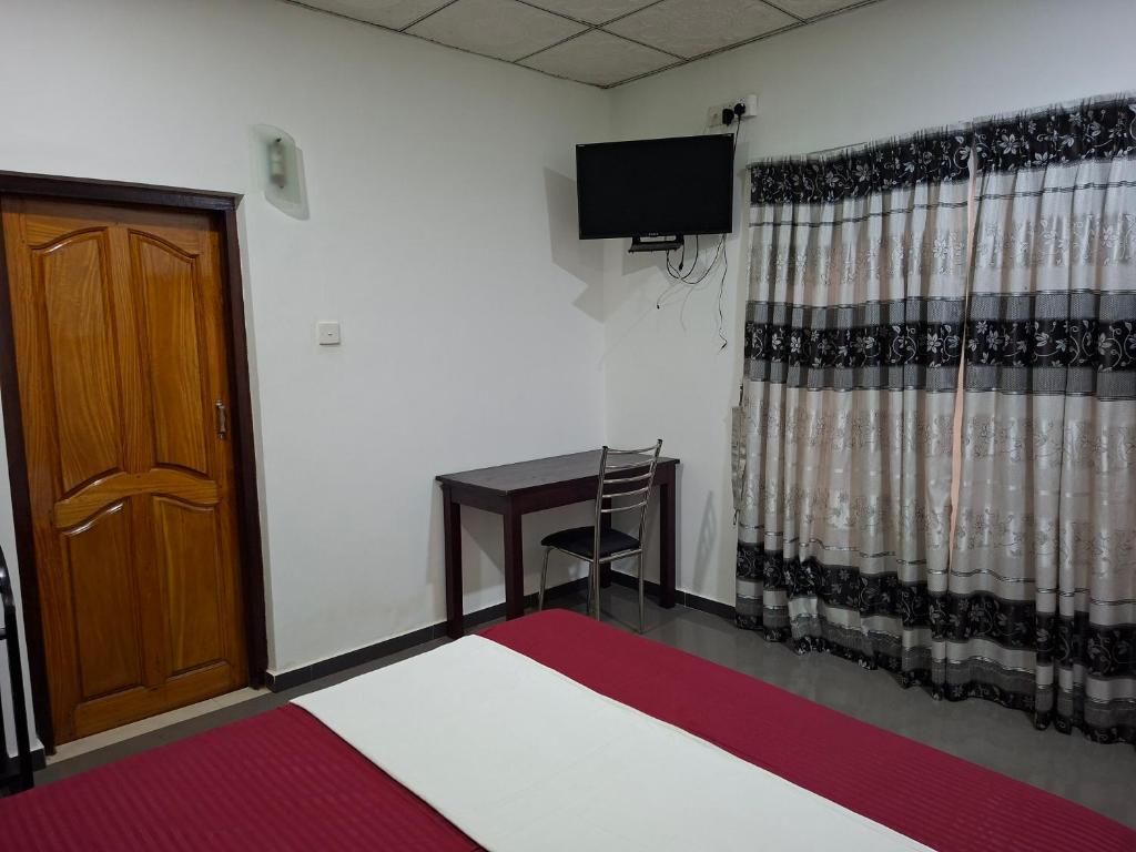 Postel nebo postele na pokoji v ubytování J City Villa