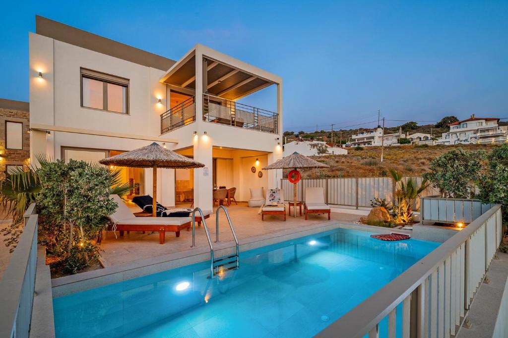 The swimming pool at or close to Ammokrinos Luxury Homes, 150m From Sea