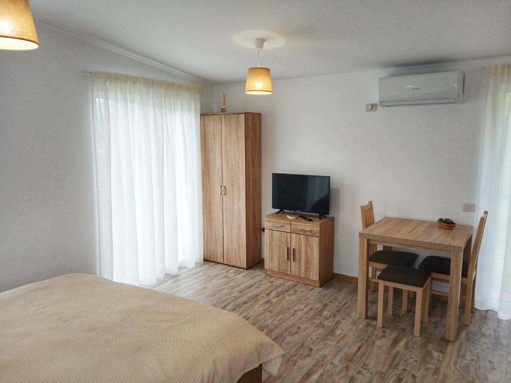 TV a/nebo společenská místnost v ubytování Greci GuestHouse