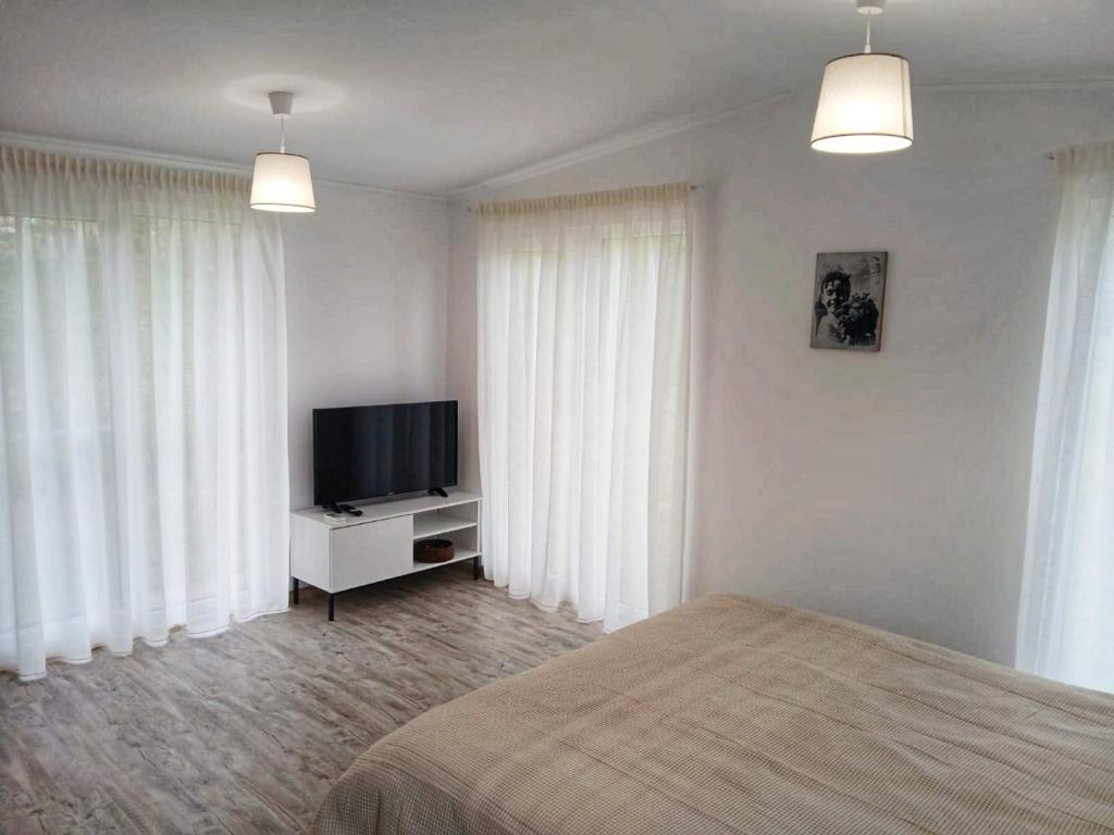 TV a/nebo společenská místnost v ubytování Greci GuestHouse