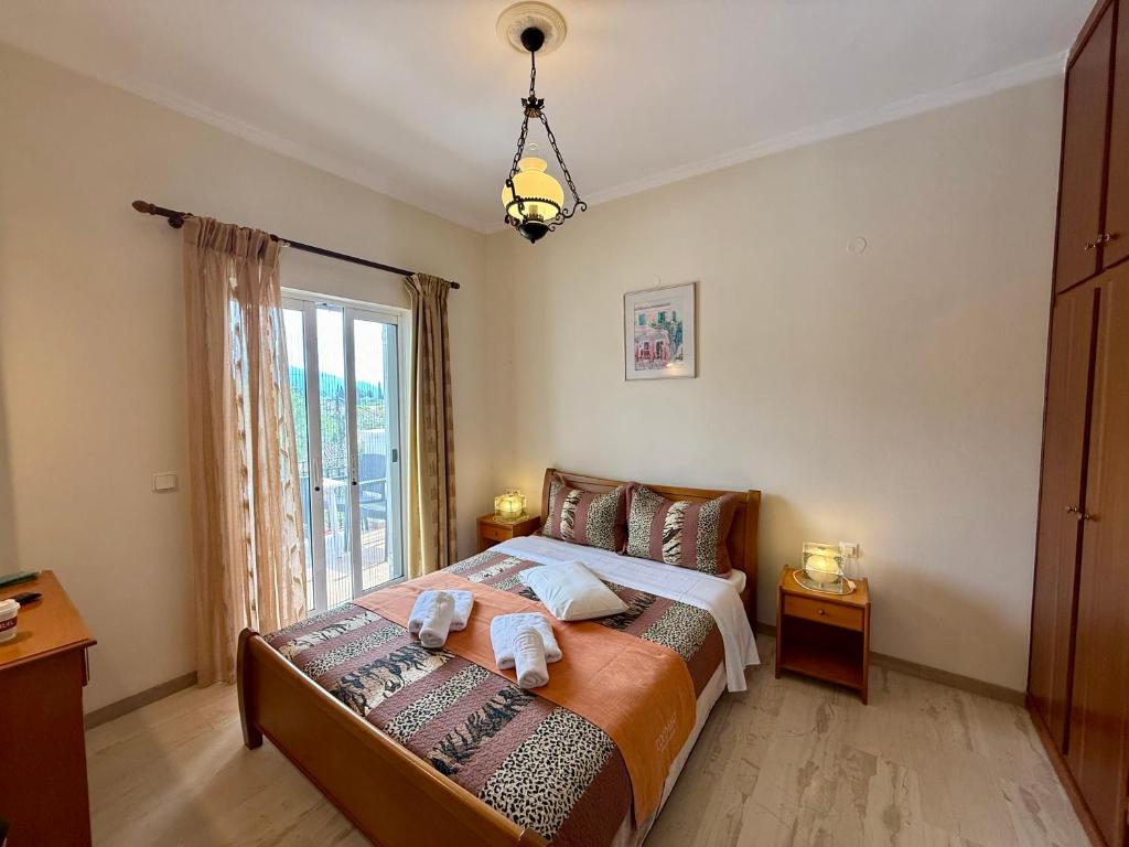 Postel nebo postele na pokoji v ubytování Thomas Apartments