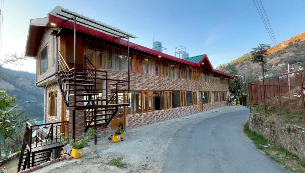 a house on the side of a road at Kaushalya Homes in Shimla