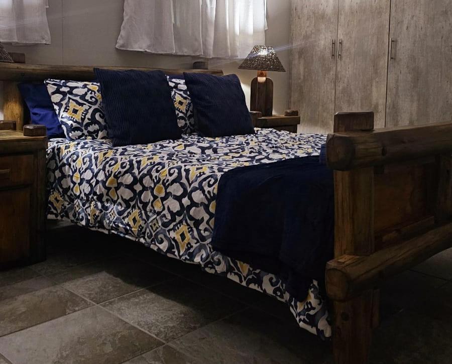 Ένα ή περισσότερα κρεβάτια σε δωμάτιο στο CasaMari guesthouse