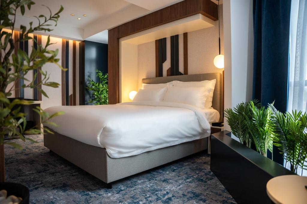 Postel nebo postele na pokoji v ubytování Hotel Rubin DHS