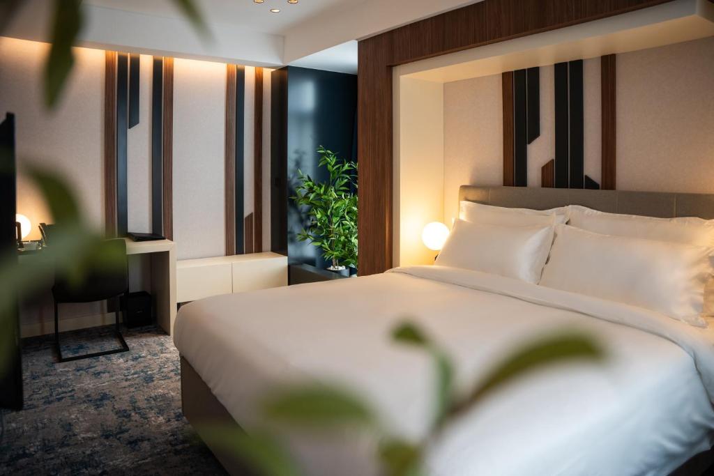 Postel nebo postele na pokoji v ubytování Hotel Rubin DHS
