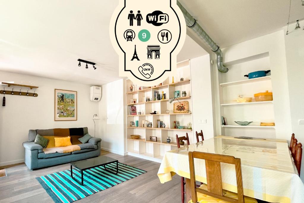 a living room with a table and a couch at Loft Évasion aux Portes de Paris in Bagnolet