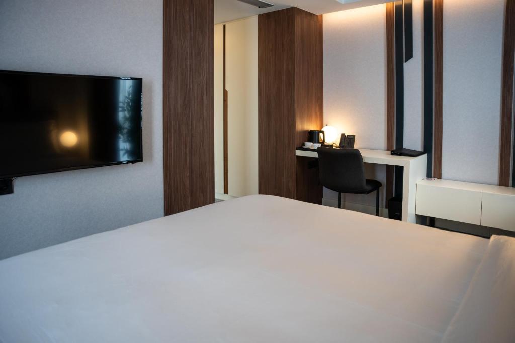 Postel nebo postele na pokoji v ubytování Hotel Rubin DHS