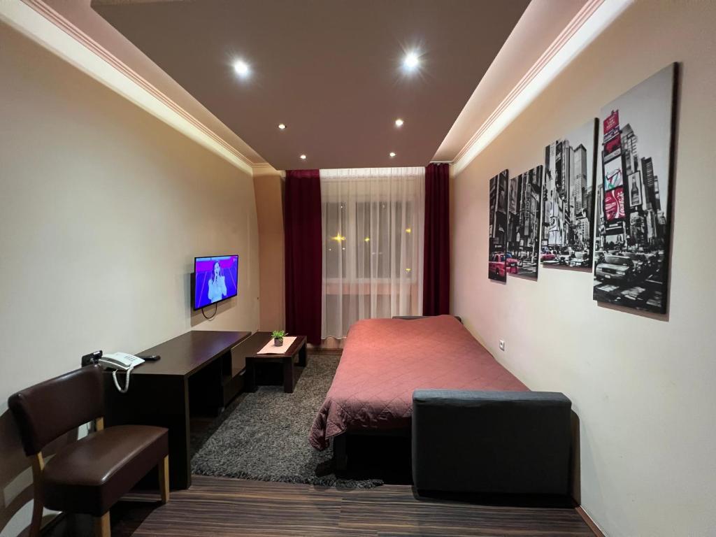 TV a/nebo společenská místnost v ubytování Hotel Petrus