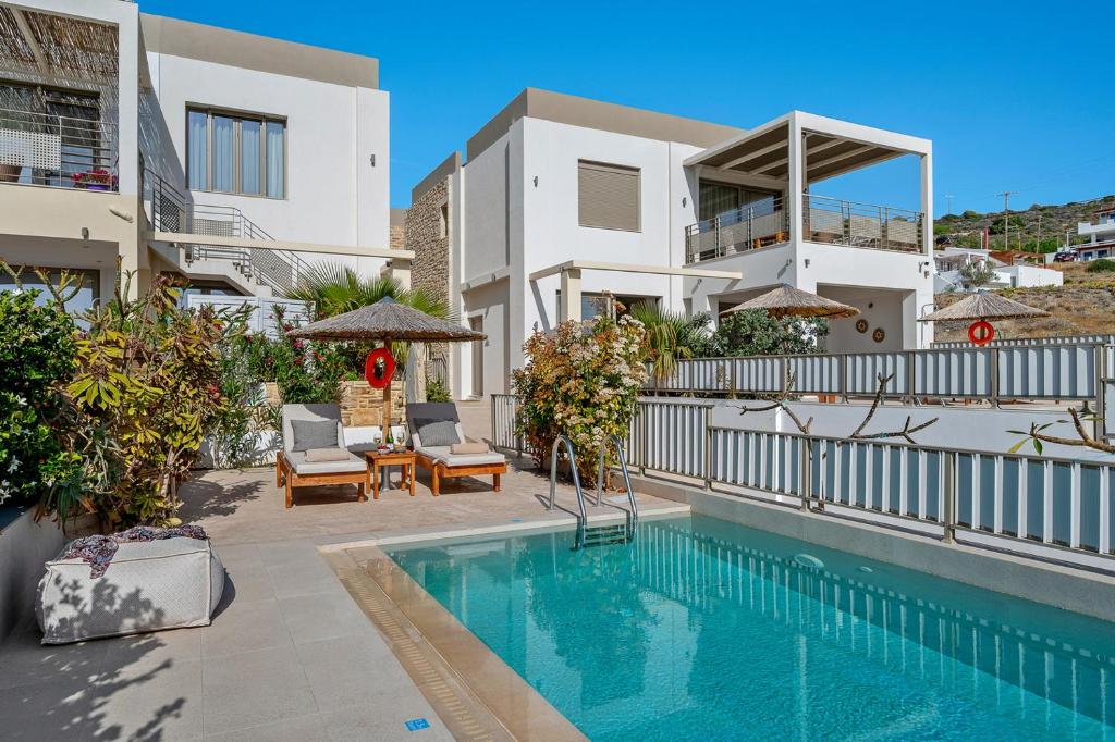 The swimming pool at or close to Ammokrinos Luxury Homes, 150m From Sea