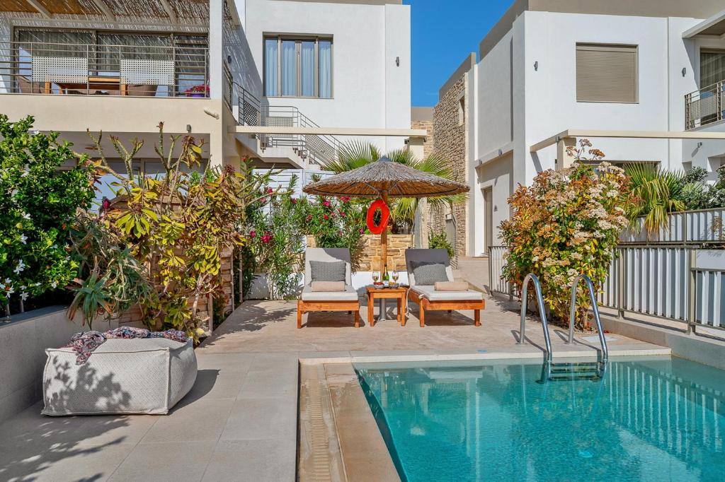 The swimming pool at or close to Ammokrinos Luxury Homes, 150m From Sea