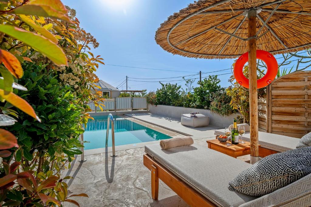The swimming pool at or close to Ammokrinos Luxury Homes, 150m From Sea