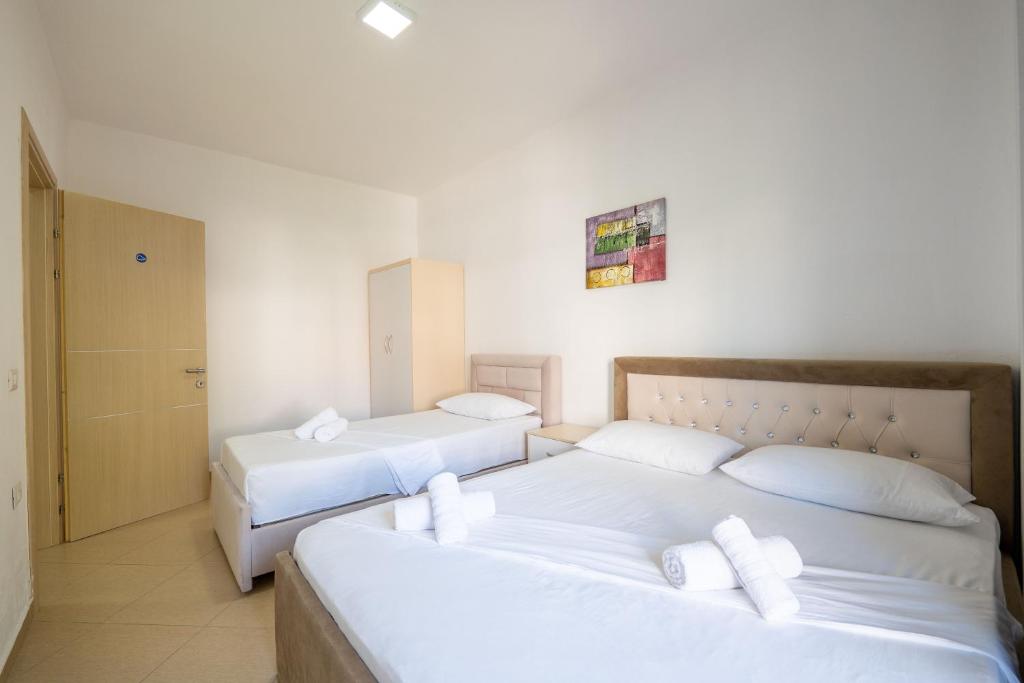 Postel nebo postele na pokoji v ubytování SoleLuna Aparthotel