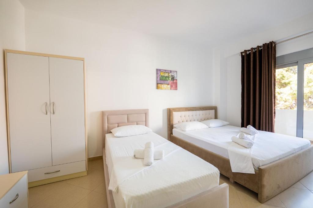 Postel nebo postele na pokoji v ubytování SoleLuna Aparthotel