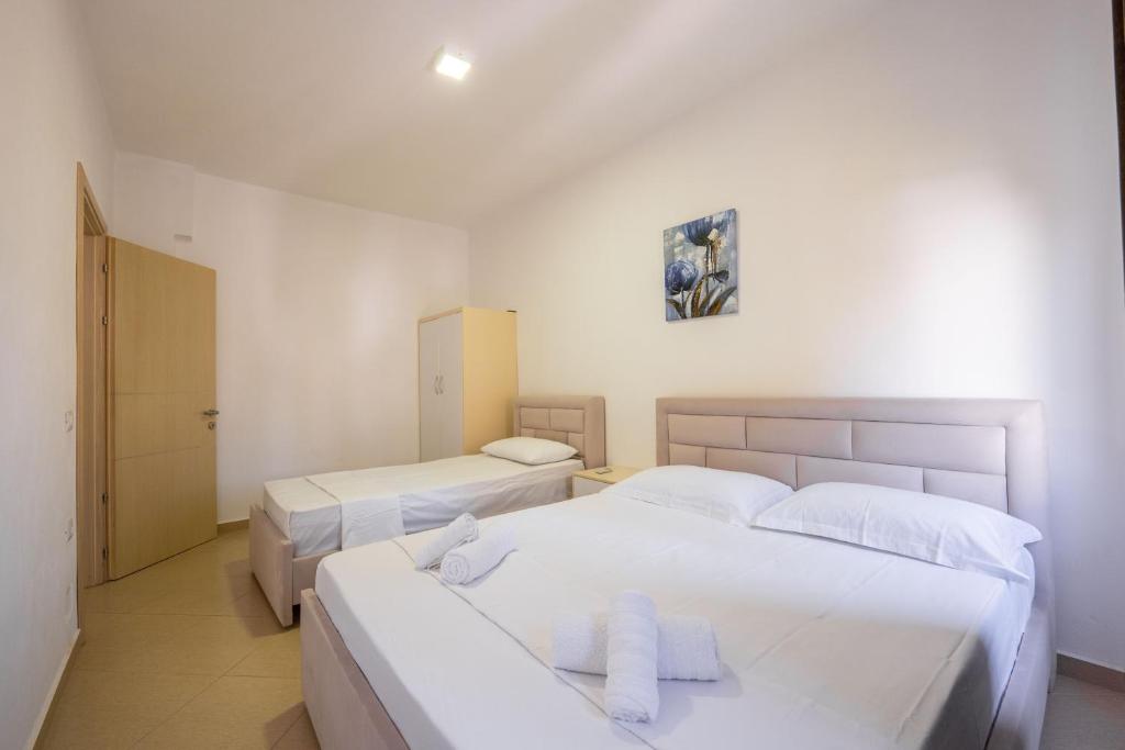Postel nebo postele na pokoji v ubytování SoleLuna Aparthotel