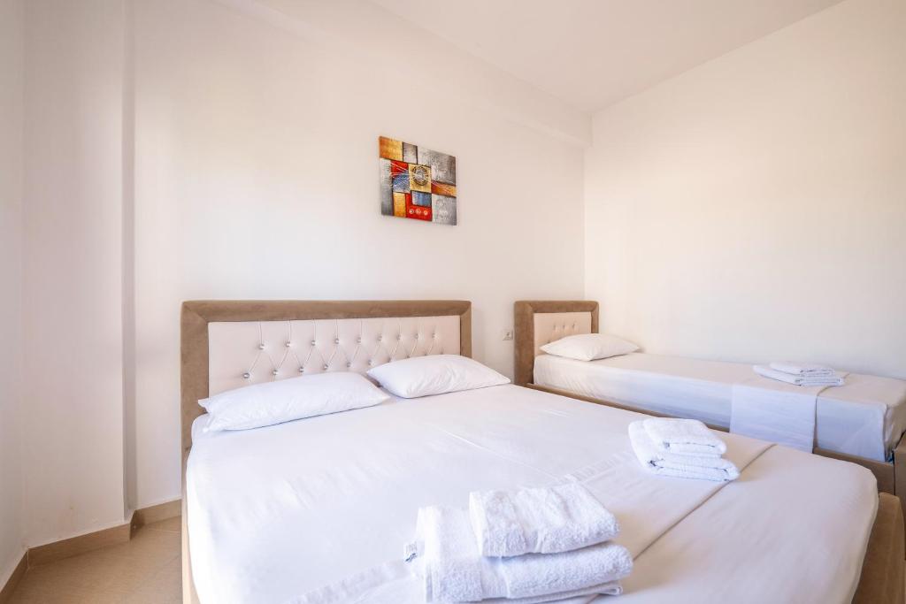 Postel nebo postele na pokoji v ubytování SoleLuna Aparthotel