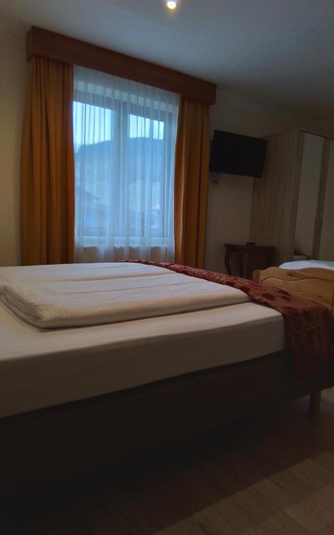 Een bed of bedden in een kamer bij Hotel Beretta