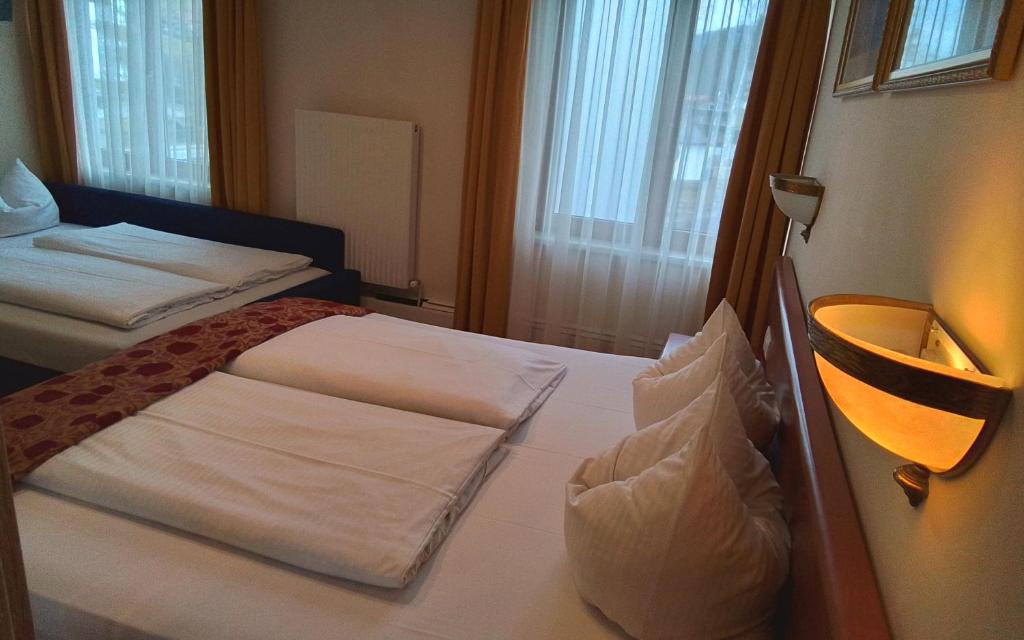Een bed of bedden in een kamer bij Hotel Beretta