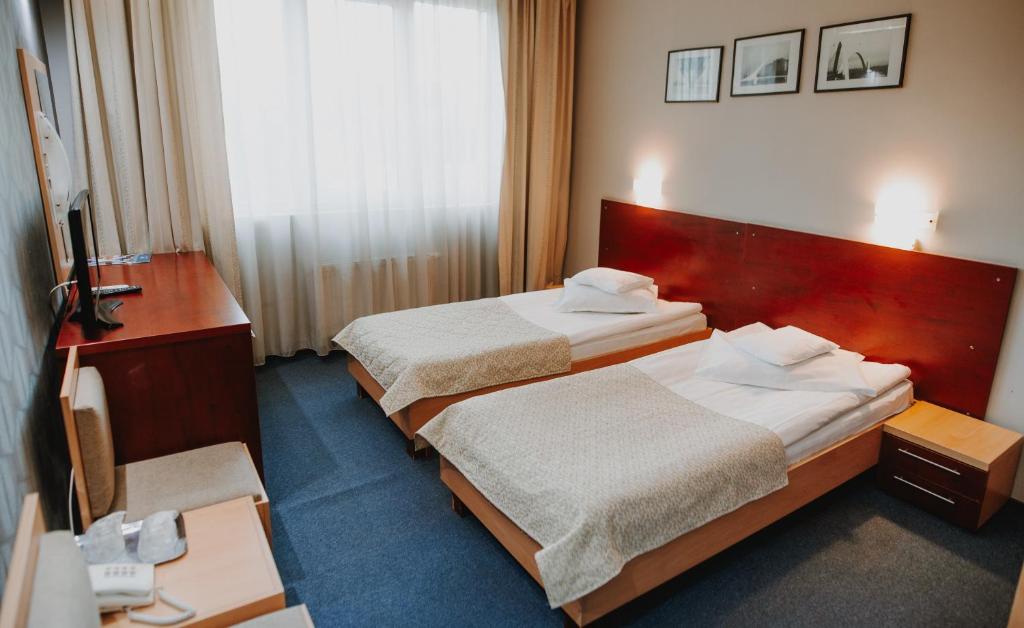 Postel nebo postele na pokoji v ubytování Hotel Concrete