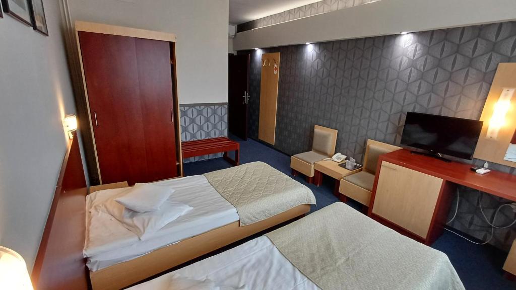 Postel nebo postele na pokoji v ubytování Hotel Concrete