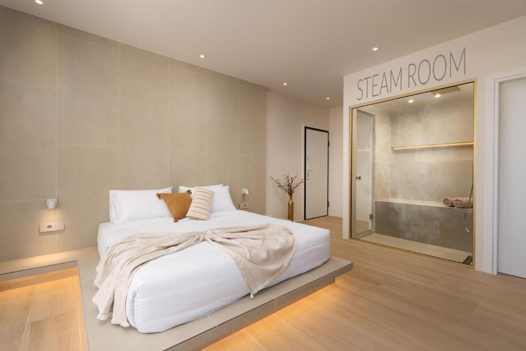 a bedroom with a white bed and a sign that reads stay room at Selected Suites in Chania Town
