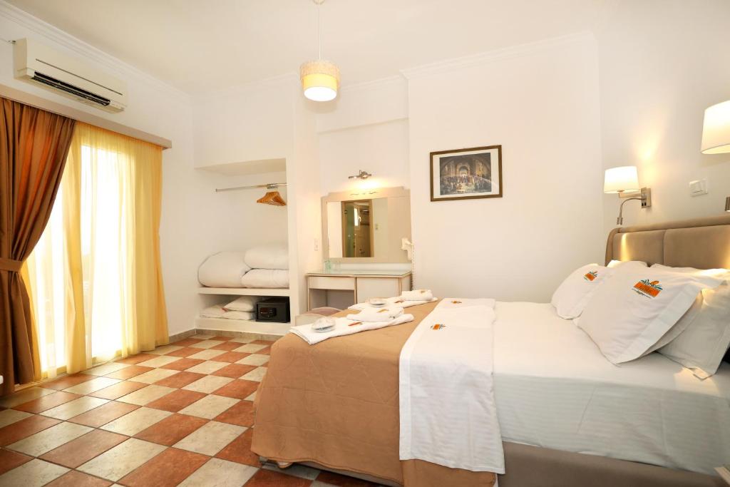 Postel nebo postele na pokoji v ubytování Hotel Klonos - Kyriakos Klonos