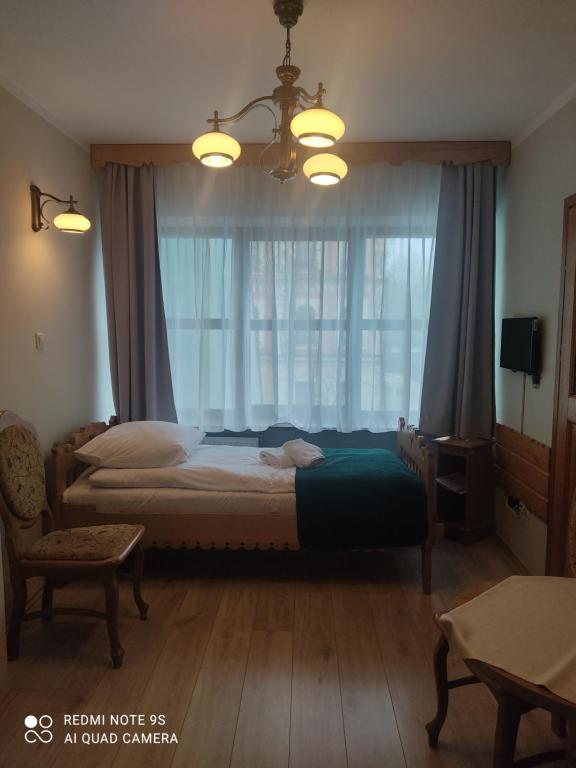 Posteľ alebo postele v izbe v ubytovaní Pokoje Gościnne Zakopane