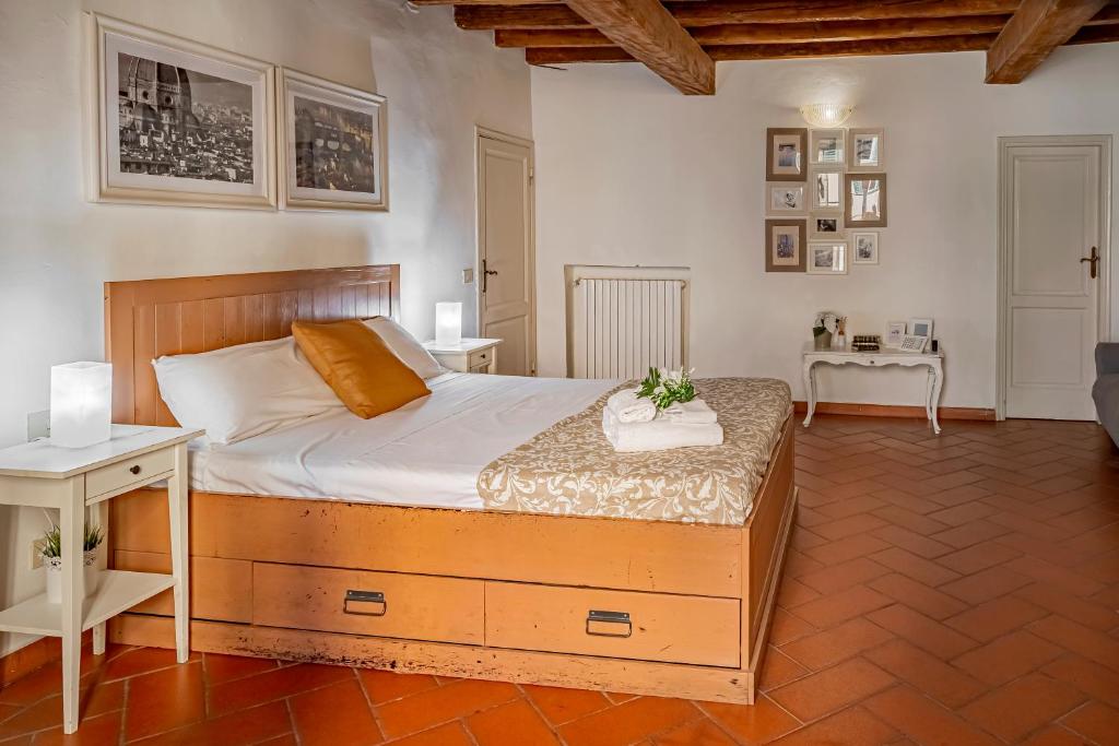 a bedroom with a bed and a living room at Dante's Relais in Florence