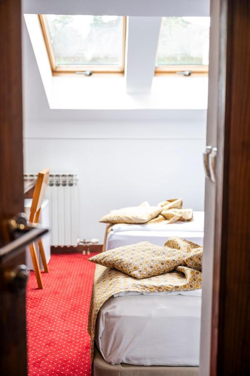 Postel nebo postele na pokoji v ubytování B&B Konak Sarajevo