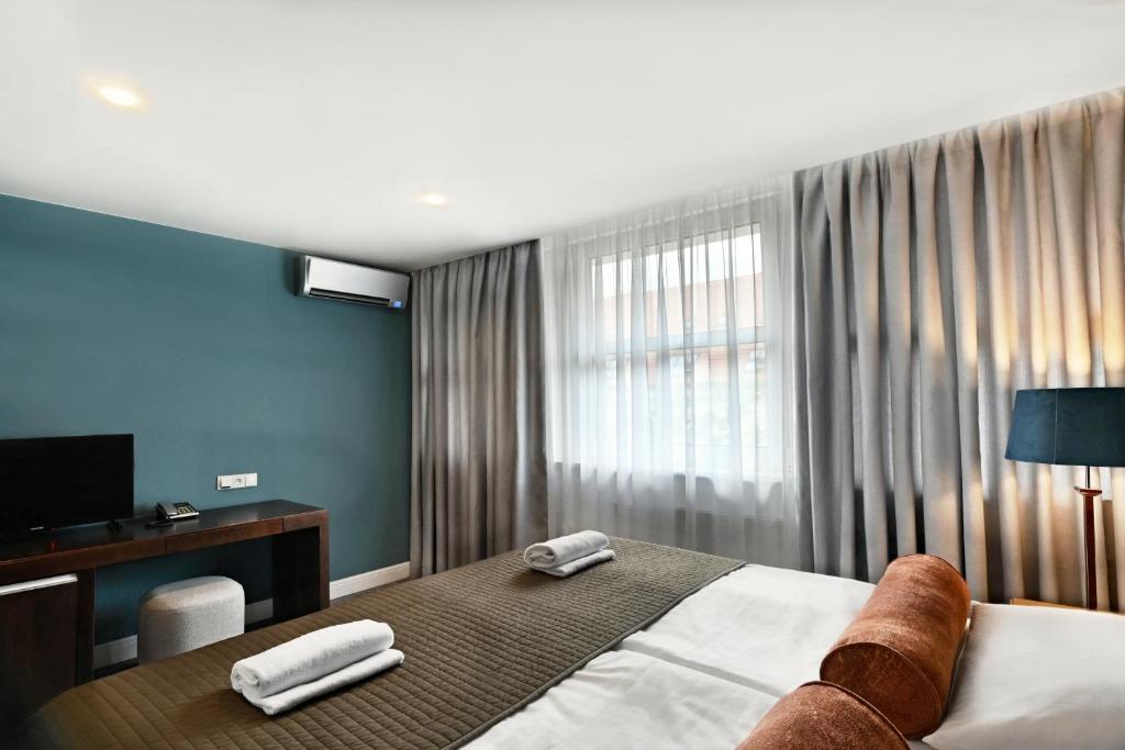 TV a/nebo společenská místnost v ubytování The Hotel Fitzgerald