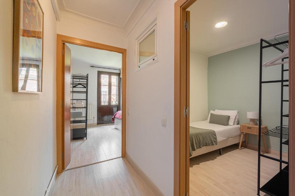 Postel nebo postele na pokoji v ubytování Stay U-nique Apartments Aribau