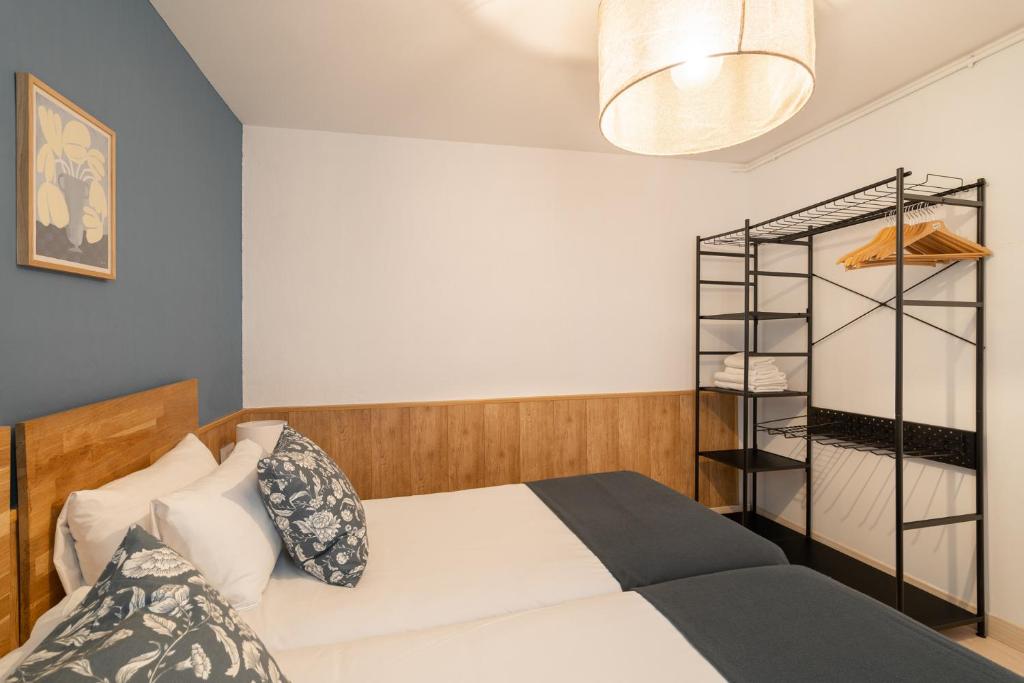 Postel nebo postele na pokoji v ubytování Stay U-nique Apartments Aribau