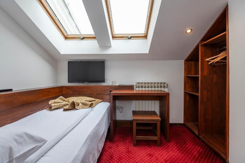 Postel nebo postele na pokoji v ubytování B&B Konak Sarajevo
