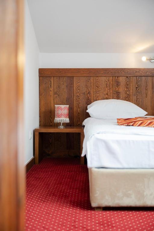 Postel nebo postele na pokoji v ubytování B&B Konak Sarajevo