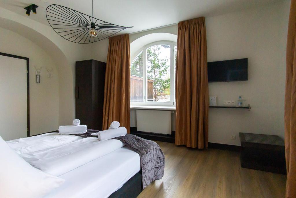 Postel nebo postele na pokoji v ubytování Hotel Wetterstein
