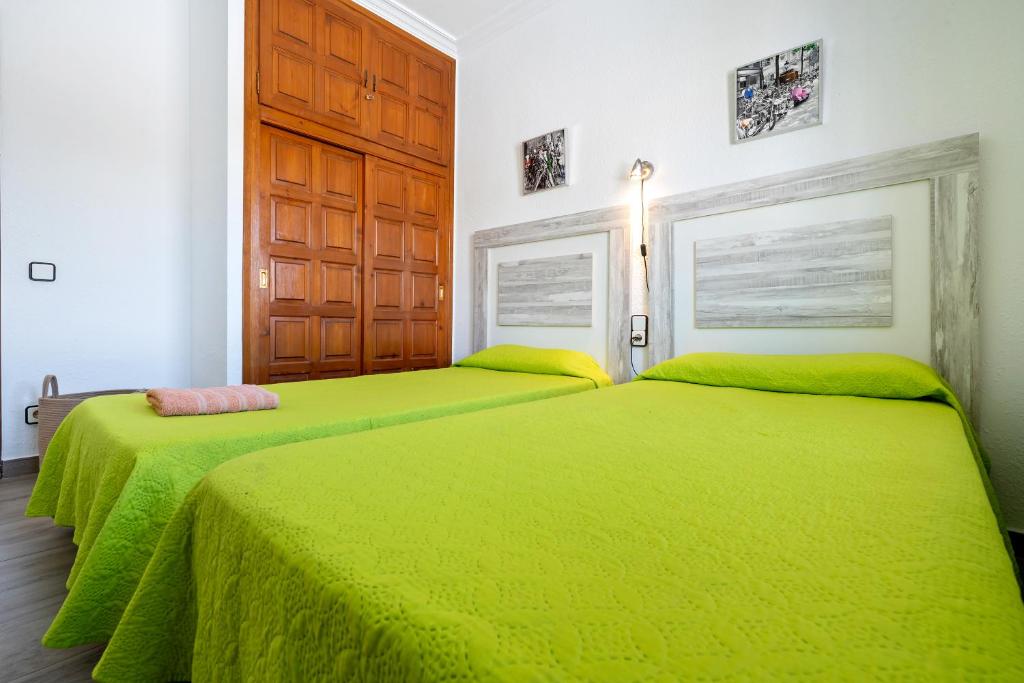 Postel nebo postele na pokoji v ubytování Palmera